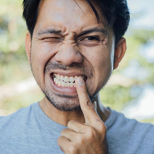 man with tooth pain